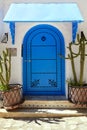 Ancient arabic door with cactuses. Royalty Free Stock Photo