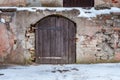 Ancient arch door in stone castle wall Royalty Free Stock Photo