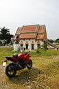 Ancient architecture antique building ubosot of Wat khien or Khian buddhist temple for thai people riding motorcycle sport travel