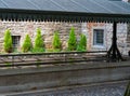 Antique public laundry in the upper city of Bergamo. Italy with green bushes and sunlight background Royalty Free Stock Photo