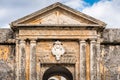 Ancient archway and medallion over door with stone columns Royalty Free Stock Photo