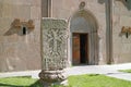 Ancient Armenian cross-stone called Khachkar in front of the Katoghike church in Kecharis medieval monastic complex, Armenia Royalty Free Stock Photo
