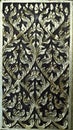 Ancient art pattern on the wooden door in Thai temple Royalty Free Stock Photo