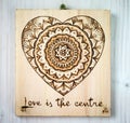 The ancient art of pyrography, wood and fire, mandala Royalty Free Stock Photo