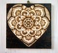 The ancient art of pyrography, wood and fire, mandala Royalty Free Stock Photo