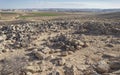 Ancient Stone Ruins High Above Kibbutz Sde Boker with the Cliffs of the Nahal Zin Stream in the Background