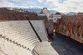 Auditorium, stage and wall of the Roman Odeon Patra Romaiko Odio Patras in Greece with a morning shadow with blue sky