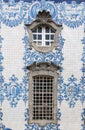 Ancient Azulejo on Carmo church in Porto Portugal window and tile detail.
