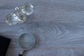 Ancient balance scale with magnifying glass and notebook on wooden table with copy space