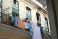Ancient balcony on the street with drying sheets