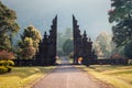 Ancient bali gate with pathway in garden Royalty Free Stock Photo