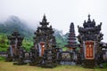 Ancient Balinese hindu temple at Buyan lake in mountain rainforest