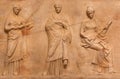 Ancient Greek bas-relief from funerary monument depicting Delian trinity - Leto, Apollon and Artemis. Arcadia, Greece