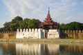 Ancient bastion and gate of the old city in evening light. Mandalay, Burma