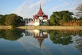 An ancient bastion of the old city with a reflection in the evening light. Mandalay, Burma