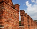 Ancient Battlements with crenellations on the wall made with old bricks Royalty Free Stock Photo