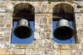 Ancient bell tower with bells and blue sky Royalty Free Stock Photo