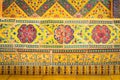 Ancient Benjarong ceramic texture paint tiles patterns Thai style on the wall decorate of Wat Ratchabophit temple on panel