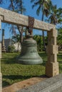Ancient big bronze and iron bell with carvings hanging from a concrete support, Chennai, Tamil nadu, India, Jan 29 2017