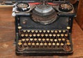 Ancient black rusty typewriter used by typists than once Royalty Free Stock Photo