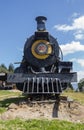 An ancient black and yellow locomotive