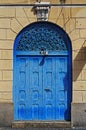 Ancient blue door on facade in downtown Rio de Janeiro