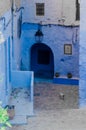 Ancient blue door and wall in chefchaouen, morocco Royalty Free Stock Photo