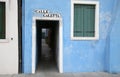 blue house of the BURAN island near VENICE with the street sign Royalty Free Stock Photo