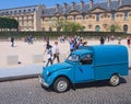 Ancient blue van - iconic Citroen 2CV Fourgonnette, front view. Place du Carrousel at sunny day