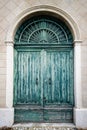 Ancient blue wooden door eroded by time