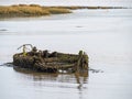 Ancient boat, ship decomposing in the boat graveyard near Appledore, North Devon. Royalty Free Stock Photo