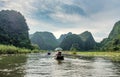 Ancient boating with vietnamese using foot paddle and view limes