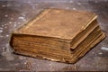 Ancient book on old wooden table Royalty Free Stock Photo