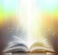 An ancient book that opens with magic, the magic light in the darkness on the wooden table, by the bright light shining down as th Royalty Free Stock Photo