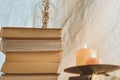 Ancient books with two burning candle on white background Royalty Free Stock Photo