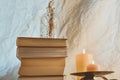 Ancient books with two burning candle on white background Royalty Free Stock Photo