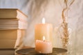 Ancient books with two burning candle on white background Royalty Free Stock Photo