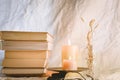 Ancient books with two burning candle on white background Royalty Free Stock Photo