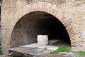 Ancient brick arch at small Roman theater in Taorm