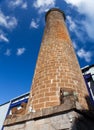 Ancient brick pipe in the old sugar cane factory. Mauritius. Royalty Free Stock Photo