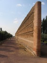 Ancient brick wall in the middle of a park to Tivoli in Italy.