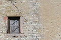 Ancient brick wall with old wooden window shutters Royalty Free Stock Photo