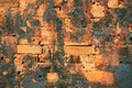 Ancient brick wall texture. Orange bricks closeup. Weathered grungy brick wall photo background