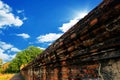 Ancient brick wall in Thailand With blue sky. Royalty Free Stock Photo