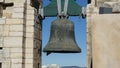 An ancient bronze bell in the tower of a cathedral in Algarve region, southern Portugal.