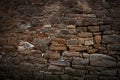 Ancient brown wall made of different sizes stones