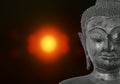 ancient Buddha image on blurry candle light in dark