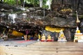 Ancient buddha reclining statue in antique cave of Wat Khao Phra Si Sanphet Chayaram temple for thai people travelers travel visit