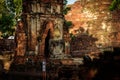 Ancient Buddha Statue broken in the morning with sunrise at Mahathat Temple, Ayutthaya, Thailand.