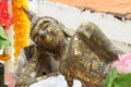 Ancient buddha statue lying sleeping gold leaf historical landmark Royalty Free Stock Photo
